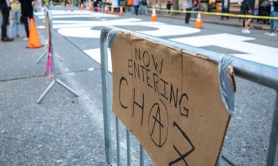 Now Entering CHAZ sign with an Anarchist Symbol | One Dead, One in Critical Condition in Early Morning Shooting at Capitol Hill Protest Zone Known as CHOP | Featured