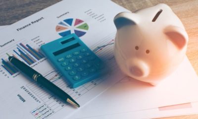 Piggy Bank with Business Stuff | Study Shows That Less Than Half of Americans Are Worried About Money Despite COVID-19 Pandemic | Featured