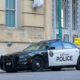 Police Vehicle Parked on the Street | Two Buffalo Police Officers Suspended After Video Shows Elderly Man Falling to the Ground and Bleeding | Featured