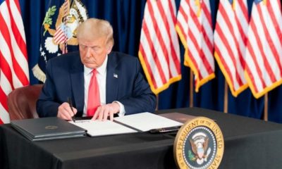 President Donald Trump signing a Presidential memorandum | Trump Signs Executive Order on Police Reform | Featured