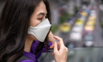 Young Woman wearing Face Mask in the Public Transportation | WHO Official Says Asymptomatic Spread of COVID-19 “Appears to Be Rare” | Featured