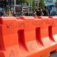 Welcome 2 Free Cap Hill Sign on a Barricade at The Capitol Hill Autonomous Zone | Seattle Businesses Sue the City Over an “Occupied Protest” | Featured