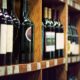 Wine Bottles on Wooden Shelf in Wine Store | 88-Year-Old Liquor Store Owner Shoots Alleged Shoplifter: “I’m Fed Up and I’m Not Taking It Anymore" | Featured
