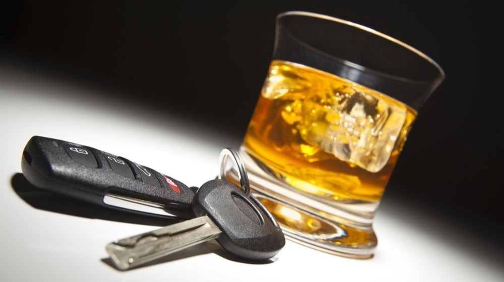 Alcoholic Drink and Car Keys Under Spot Light | Illegal Immigrant Kills Three People in Drunken Driving Incident | Featured
