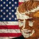 An Illustration of a Portrait of Republican Presidential Candidate Donald Trump on National Flag Background | Activist Burns Trump Flag Outside Lackawanna County Courthouse | Featured