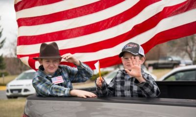 Boys Riding in the Back of a Truck at a Protest | Austin Schools Failed to Stop Bullying of Trump-Supporting Student, Suit Alleges | Featured