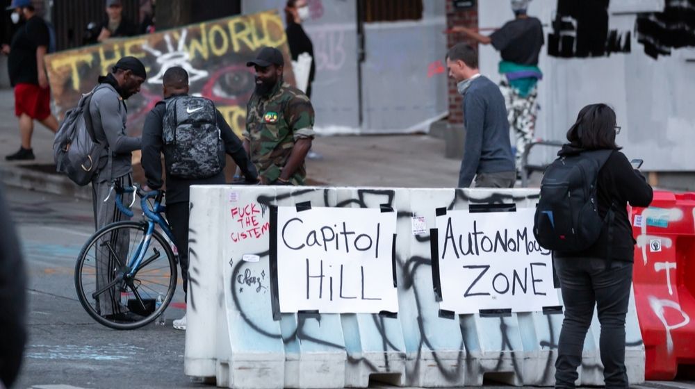Capitol Hill Autonomous Zone Sign on a Barricade | Seattle Finally Breaks Up “CHOP” Zone | Featured