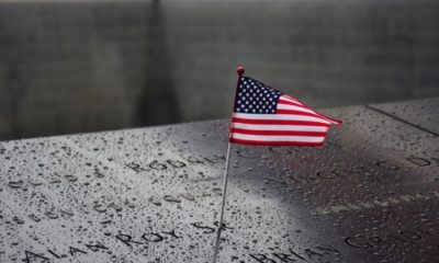 Memorial at Ground Zero Manhattan for September 11 Terrorist Attack with an American Flag | Vandalism at 9/11 Memorial Prompts Outpouring of Donations and Support | Featured