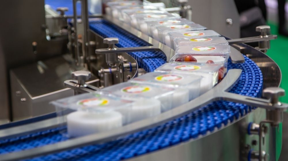 Packing Food in Plastic Box in Production Line | Three California Food Suppliers Are Ordered to Shutter Following Unreported Coronavirus Outbreaks | Featured