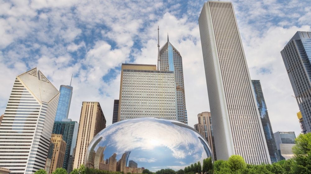 Reflection of a Chicago Buildings in a Mirror of Chicago Bean | Mass Shooting at Funeral Home in Chicago Sends 15 Victims to Hospitals | Featured