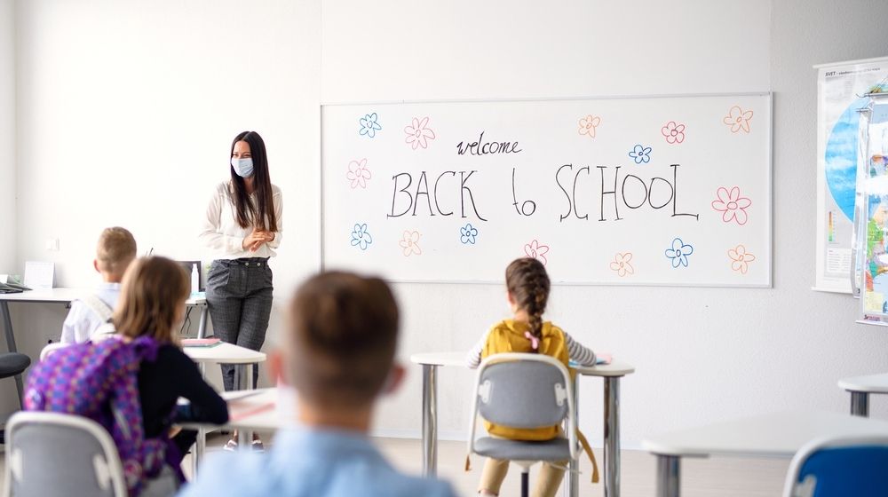 Teacher with Face Mask Welcoming Children Back at School After Lockdown | President Donald J. Trump Is Supporting the Safe Reopening of America's Schools | Featured