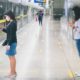 Two Young Asian Woman Wearing Protective Face Mask | Experts Call for Federal Intervention as Top Doc Warns COVID-19 Cases Could Top 100K Per Day | Featured