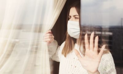 Young Woman in Medical Mask | Coronavirus Lockdown Leads to Double-Digit Weight Gain for Americans | Featured