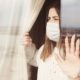 Young Woman in Medical Mask | Coronavirus Lockdown Leads to Double-Digit Weight Gain for Americans | Featured