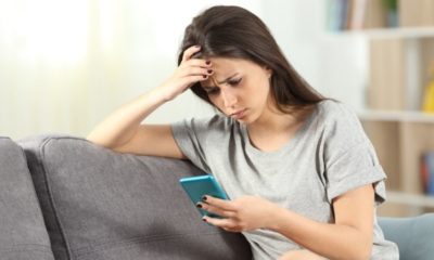 Sad Teen Reading Bad News in a Smart Phone | Americans’ Social Media Habits Change Following This Year’s Tensions | Featured