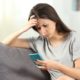 Sad Teen Reading Bad News in a Smart Phone | Americans’ Social Media Habits Change Following This Year’s Tensions | Featured