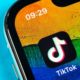 TikTok Application icon on Apple iPhone X Screen | TikTok: Clock Is Ticking | Featured