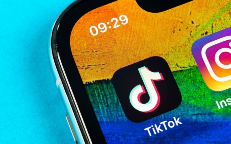 TikTok Application icon on Apple iPhone X Screen | TikTok: Clock Is Ticking | Featured