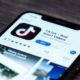 TikTok Application Icon on Apple iPhone X Screen Close-Up | Q&A: What Would a US Ban on Chinese-Owned App TikTok Mean? | Featured