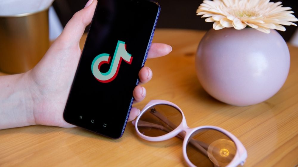 TikTtok on Phone Display | Trump Order Gives TikTok’s Owner 90 Days to Divest from U.S. Assets | Featured