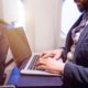 Unrecognizable Young Businessman with Notebook Sitting Inside an Airplane | Laptop Battery Catches Fire on an Alaska Airlines Boeing 737 | Featured