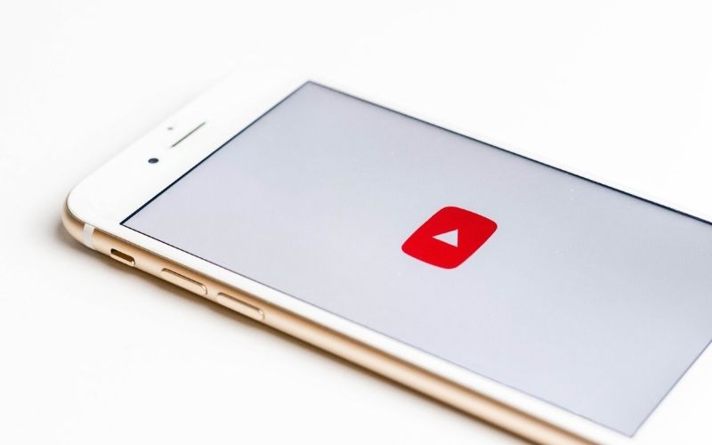 iPhone with YouTube App on Screen | YouTube Takes Down 11.4 Million Videos During COVID-19 Pandemic