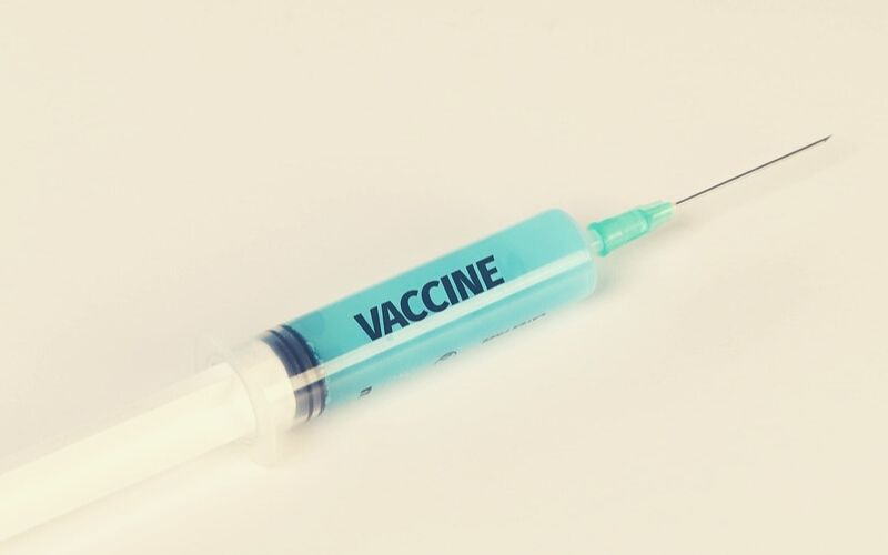Medical Syringe with Vaccine Text on it | CDC: Vaccine as Soon as Late October