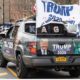 people in cars with American Flags and Trump flags | | Featured