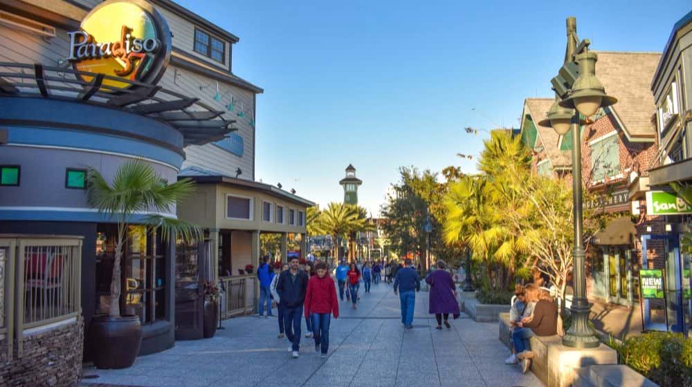 People Walking on Disney Spring Street | Disney Parks Chairman Urges California Government Officials to “Treat Theme Parks Like You Would Other Sectors and Help Us Reopen” | Featured