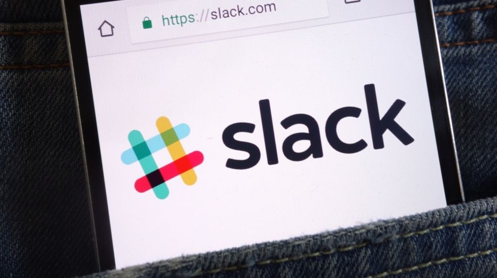 Slack Website Displayed on Smartphone Hidden in Jeans Pocket | Slack Shares Optimistic Figures as People Rely on Remote Work Tools During COVID-19 Pandemic | Featured