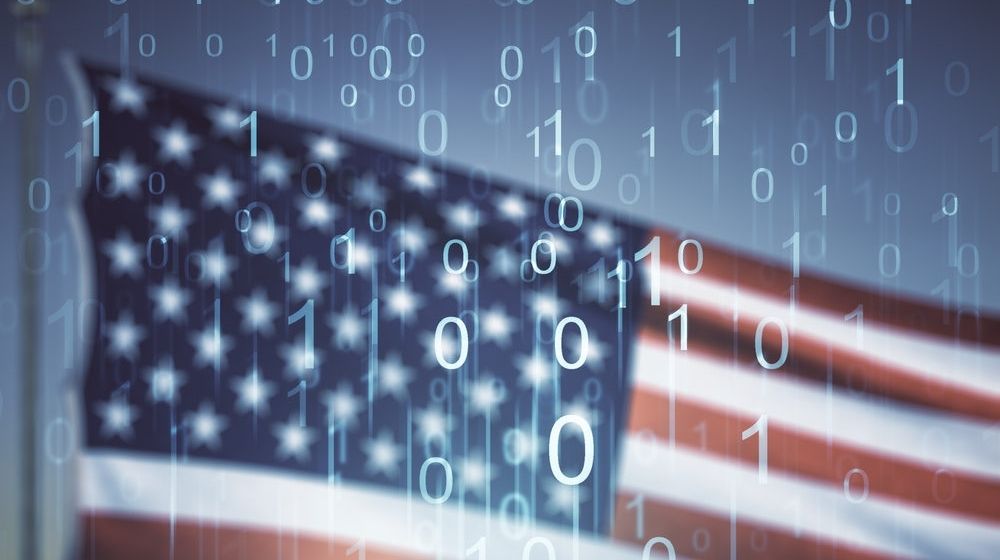 Abstract Virtual Binary Code Illustration on US Flag | U.S. Intelligence Officials: Iran Conducting Email Disinformation Campaign to Intimidate Voters | Featured