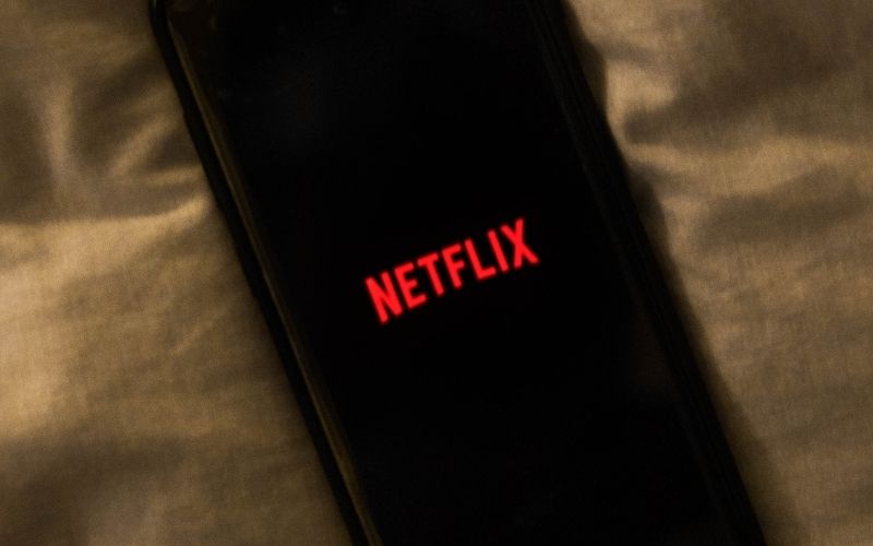 Black Mobile Phone Showing Netflix on Screen | Netflix Increases Its Standard and Premium Pricing