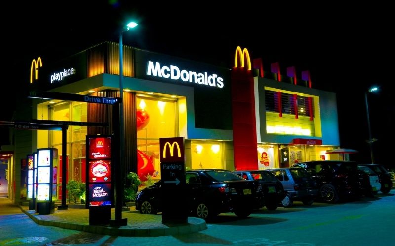 Cars Parked in Front of McDonalds | McDonald’s Implements Changes to Make Healthier Happy Meals