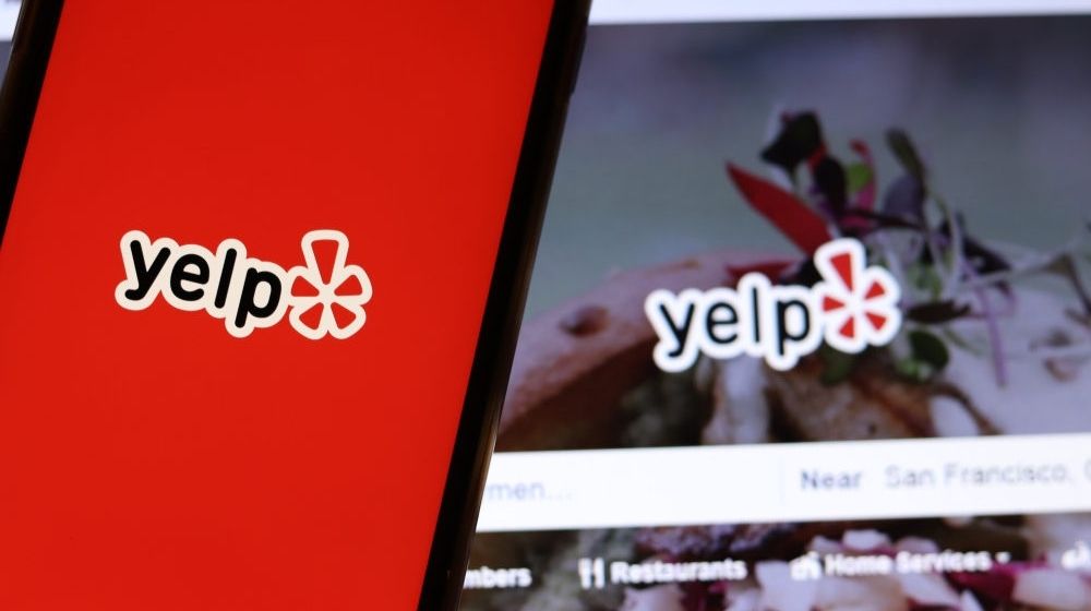 Blurred Background with Yelp Logo | Yelp to Award $2,000 to Select Users for “Re-Empty the Nest” Fund | Featured
