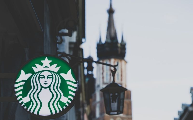 Starbucks Sign on Wall | Starbucks Enhances Corporate Workforce Diversity with New Goals