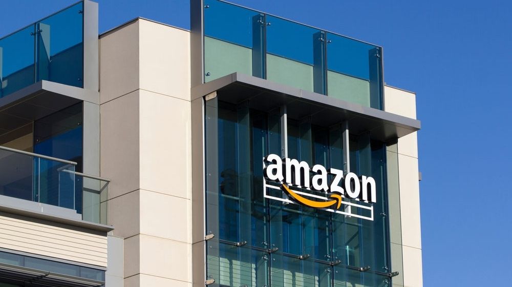 The Amazon Logo Seen at Amazon Campus in Palo Alto | Amazon Brings Back Policy That Penalizes Employees for Taking Long Breaks | Featured