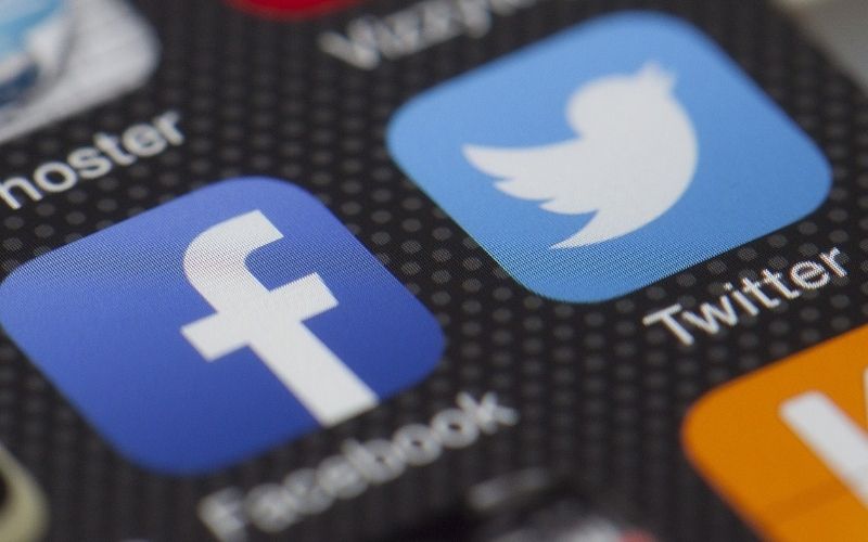 Facebook and Twitter Logo on Smartphone Screen | Study Finds That Facebook and Twitter Censored Trump 65 Times Since May 2018