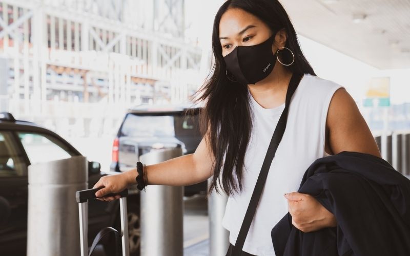 Woman in Black and White Tank Top | U.S. Officials Looking to Shorten Quarantine Time for New York-London Travels