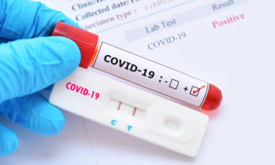A person holding a sample and a positive test result for COVID-19-Georgia Secretary of State Brad Raffensperger to Quarantine as Wife Tests Positive for COVID-19-ss-featured