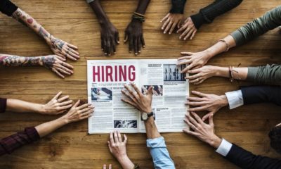 Diverse People Hands Reach Out for Hiring Newspaper Announcement-Bidens Transition Team-ss-featured