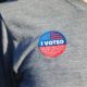 I Voted Sticker on Gray Shirt | 3 Days Post-Election: When Can We Expect a Result? | Featured