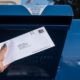 Woman Mailing Her Absentee Voter Ballot | Police Discovers Stolen Checks and Absentee Ballot in Texas Man’s Vehicle | Featured