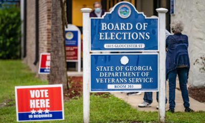 The first morning of early voting in Georgia began with lines at the Brunswick polling station and candidates boosters on the street-Georgia Recount-ss-featured