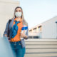 female student with face mask at a campus-Several Colleges Have Begun to Require or Encourage Students to Get Tested for COVID-19 Before Thanksgiving-ss-featured
