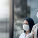 two people wearing face masks-New U.S. COVID-19 Cases Under 200K; Deaths Down For 4th Straight Day-ss-featured