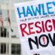 A protest sign reading Hawley Resign Now at a rally calling for the resignation of Senator Josh Hawley-Ted Cruz and Josh Hawley To Resign-ss-featured