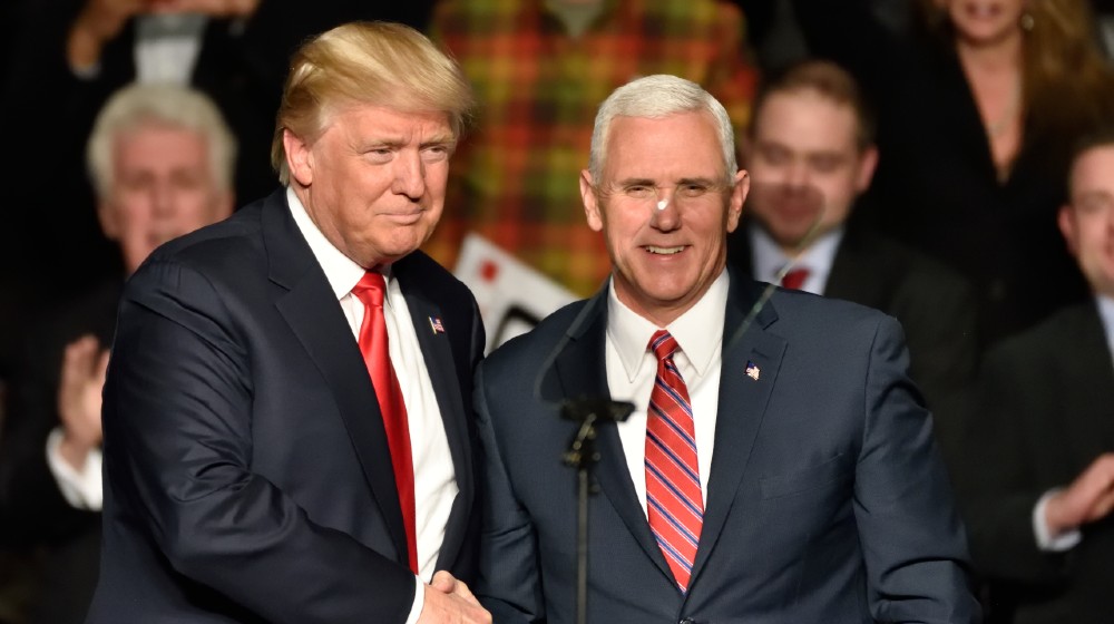 President-Elect Donald Trump and Vice President-Elect Mike Pence shake hands on stage at a Thank You rally held at the Giant Center-Trump Calls Fake News-ss-featured