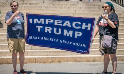 Two women holding an "impeach Trump" banner-Impeachment- House of Democrats Pushing for 25th Amendment invocation-ss-featured