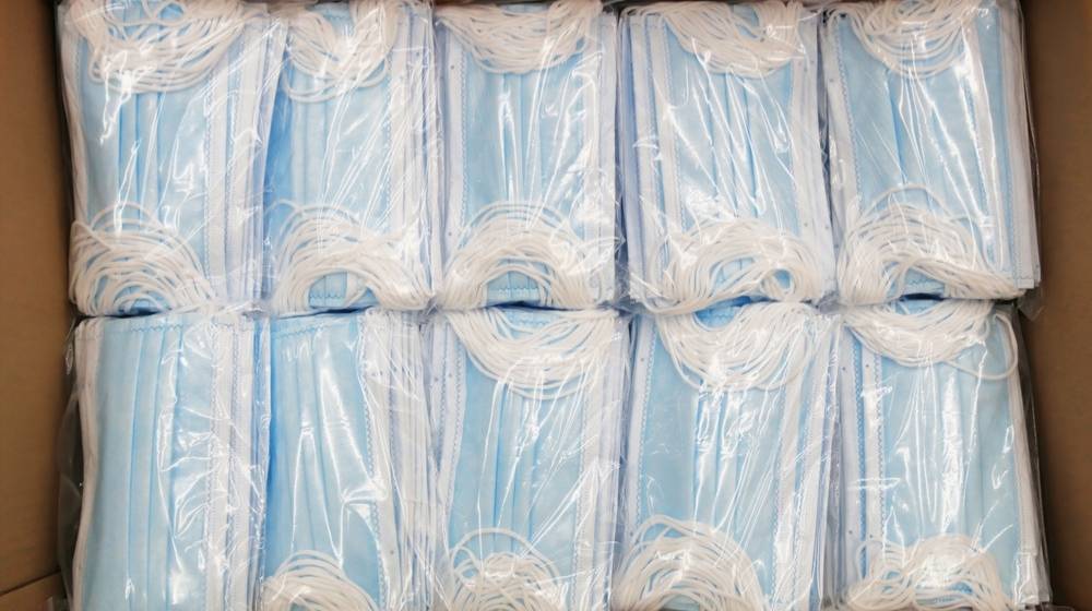 A box of surgical face masks-CDC Updates Coronavirus Guidelines- Time for Double Masking-ss-Featured