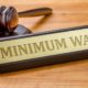A gavel and a name plate with the engraving Minimum Wage-Minimum Wage-ss-featured